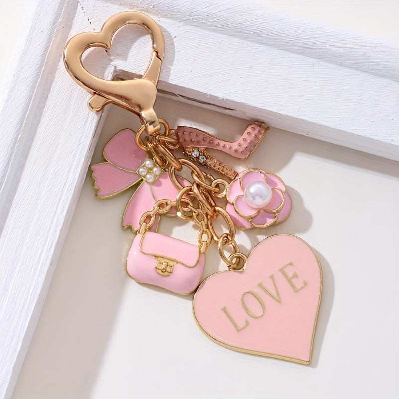 A Cute And Compact Pink Bag with a Heart-Shaped Oil Drop Keychain, Perfect As a Mini Decorative Accessory Or Gift for Cosmetics
