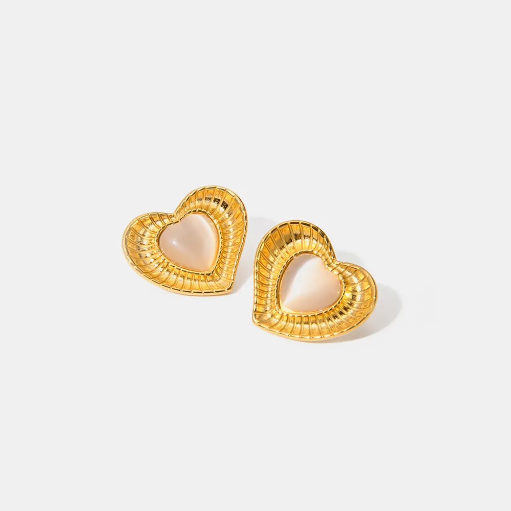 White cat eye stone earrings with niche temperament titanium steel earrings