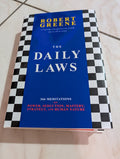 The Daily Laws: 366 Meditations on Power, Seduction, Mastery, Strategy, and Human Nature Book by Robert Greene