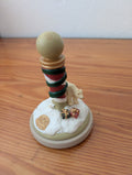 North Pole Figurine from Unknown -  Holiday Decor (Resin Figurine, Traditional, Whimsical, Cream, Red, Green, Gold)