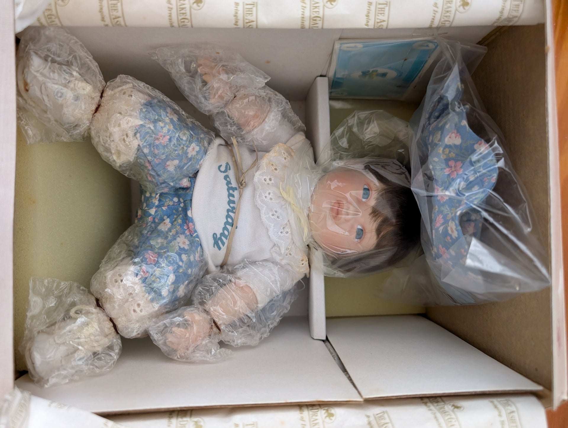 Saturday's Child (from Yolanda's Picture-Perfect Babies collection) from The Ashton-Drake Galleries - 1989 Dolls & Toys (Porcelain, Fabric Porcelain Doll, Vintage, Collectible, Nursery, Blue, White, Brown)