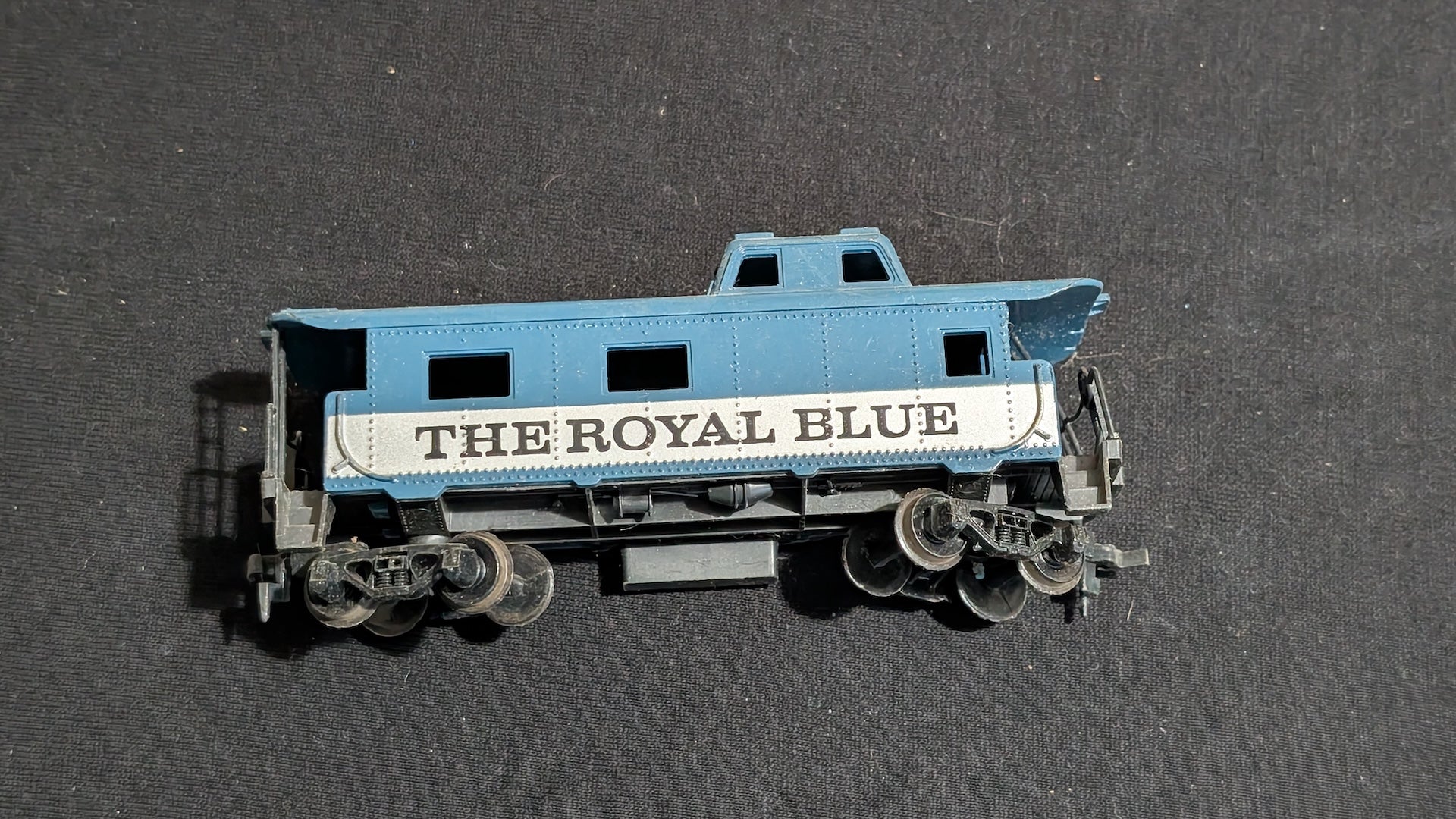 The Royal Blue Caboose Caboose likely from Tyco - 1970s HO Scale Model Train (Plastic, Metal Caboose, Not Applicable, Blue, White)