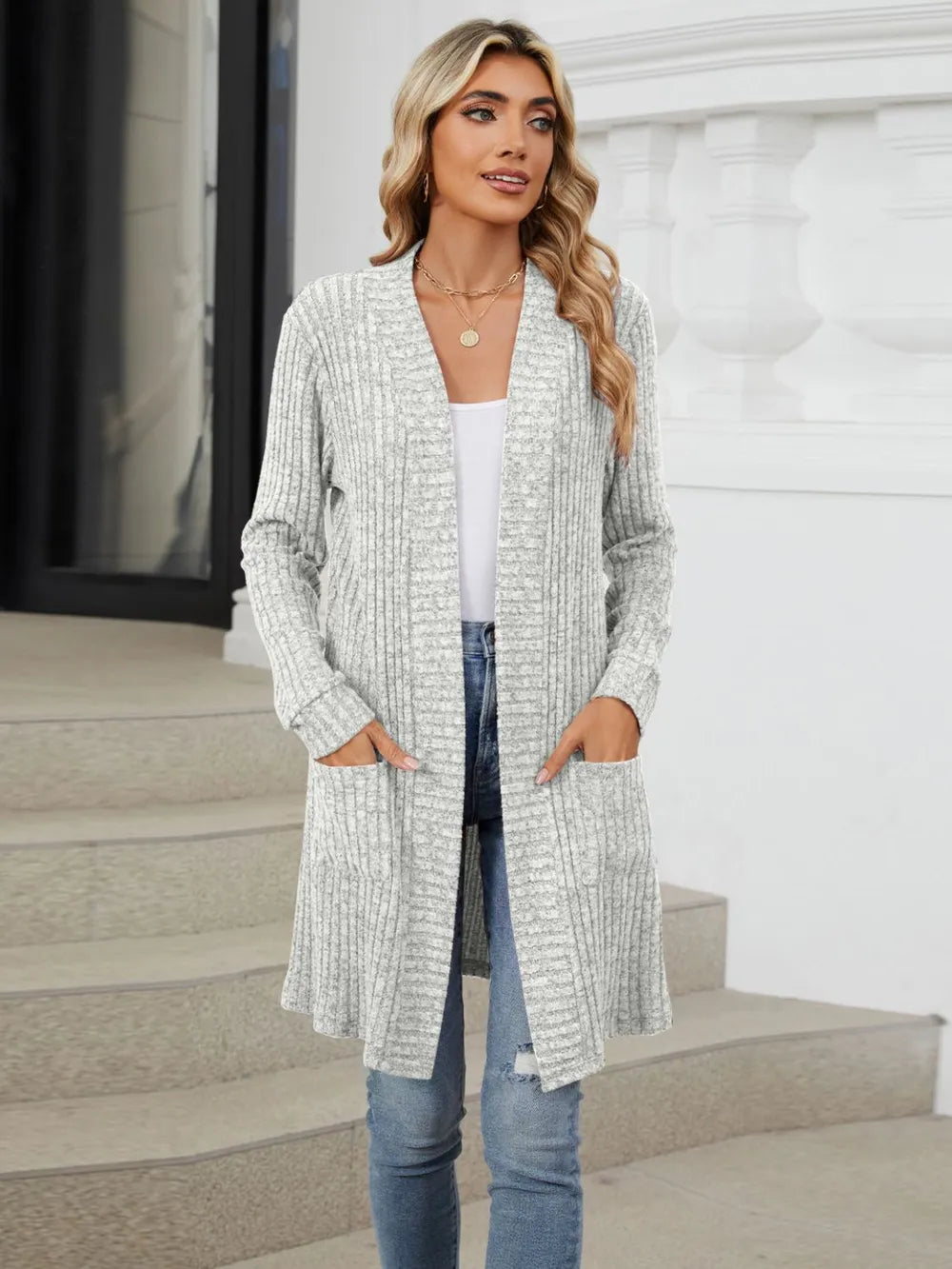 Autumn and winter long color long sleeved loose pocket cardigan jacket for women