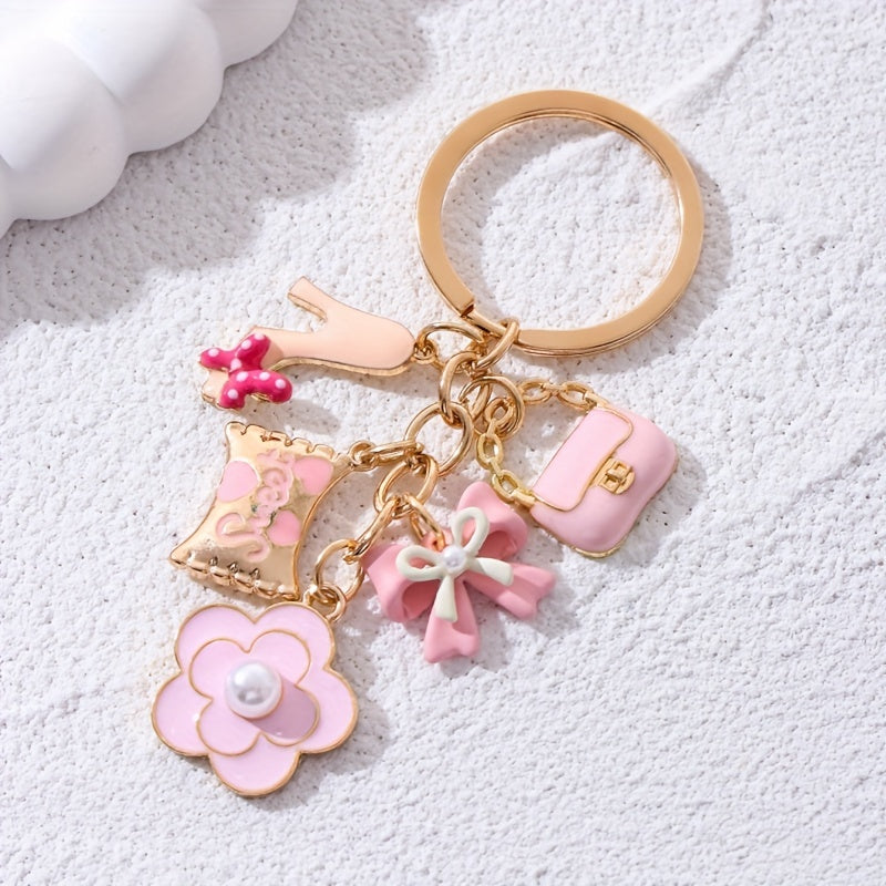 A Cute And Compact Pink Bag with a Heart-Shaped Oil Drop Keychain, Perfect As a Mini Decorative Accessory Or Gift for Cosmetics