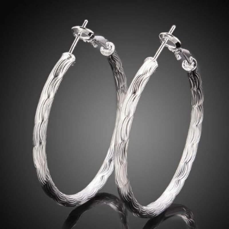 Diamond Cut Hoop Earrings In White Gold