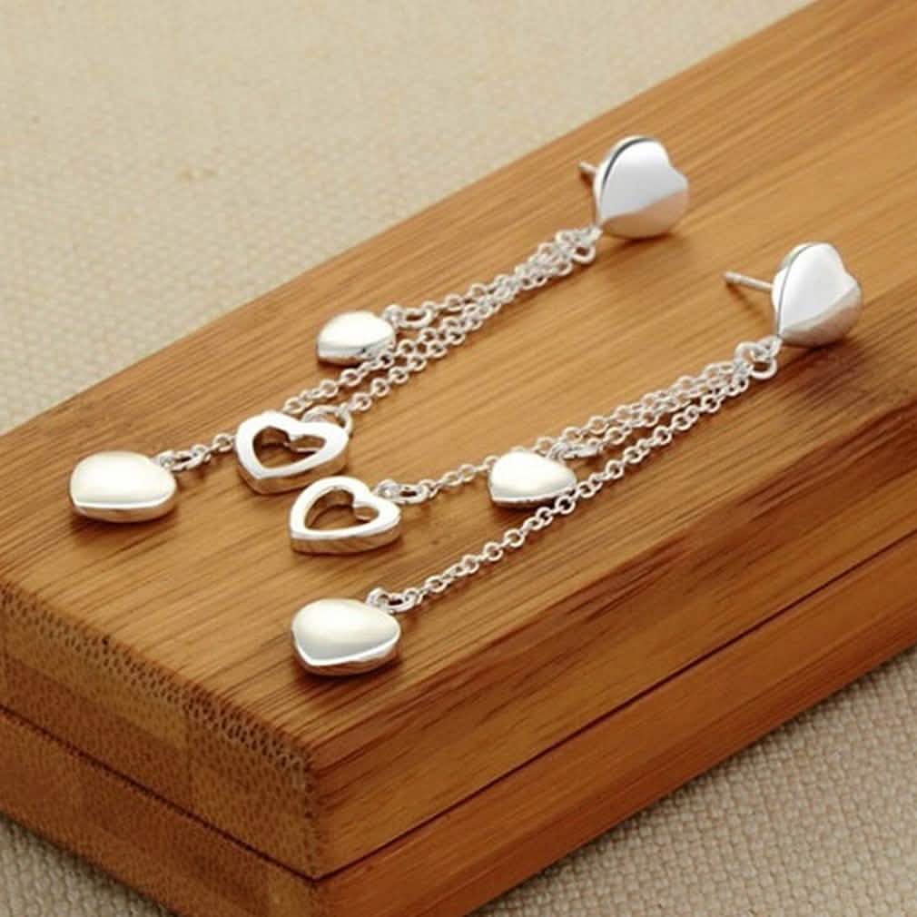 Long Dangling Heart Earrings in White Gold