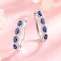 Sapphire Halo Simulated Huggie Earrings in Sterling Silver