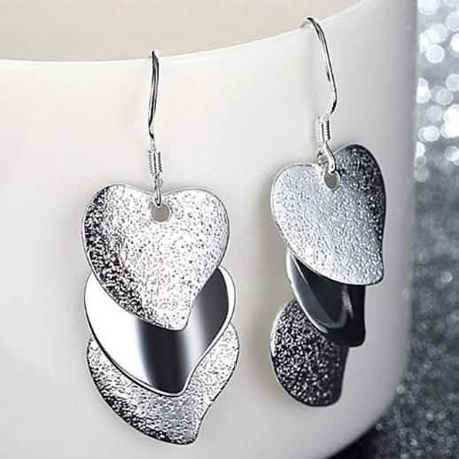 Triple Stacked Heart Earrings in White Gold
